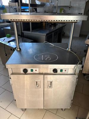 a kitchen with a stove and a counter with a number 13 on it