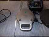 a nintendo wii game system sitting on a bed