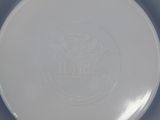 a white frisbee that is sitting on a table