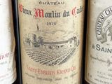 several bottles of wine are lined up on a table