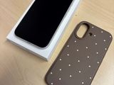 a phone that is sitting on a table next to a box