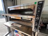 a pizza oven that is sitting on top of a table