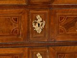 a large wooden chest of drawers with many drawers