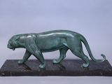 bronze sculpture of a panther on a marble base