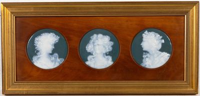 three framed images of two women in profile, one in profile and the other in profile