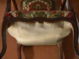 a chair that has a cushion on top of it