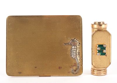 an image of a gold cigarette case and lighter with a seahorse on it