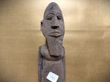 a statue of a man with a beard and a tag on his neck