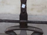 an old iron fire hydrant with a stick sticking out of it