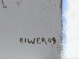 a fire hydrant that is on the side of a building