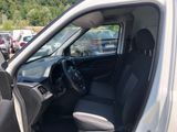 the interior of a white van with the door open and the driver ' s seat down