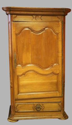 an image of a wooden cabinet with a door on top of it