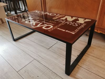 a glass table with words on it in a room