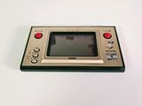an old game console sitting on top of a white table