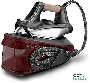 a red and black steam iron sitting on a white surface