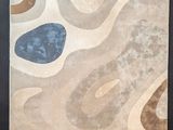 an image of a rug with a blue and brown design on it