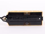 an image of a black and gold box with a name on it