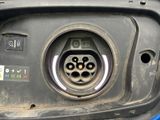 a close up of a car ' s electrical plug in the trunk of a car
