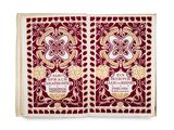 two red and gold book covers with ornate designs on them