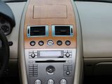 a dashboard of a car with a steering wheel and dashboard controls