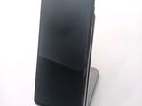 a cell phone that is sitting on top of a stand