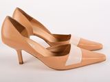 a pair of nude colored heels with two toneed heels