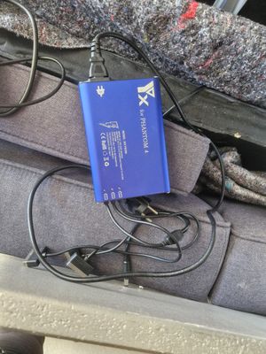 a blue battery in the back seat of a car