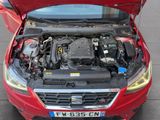 a red car with its hood open and the engine in the trunk