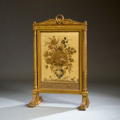 un cadre doré orné d'une peinture représentant des fleurs
