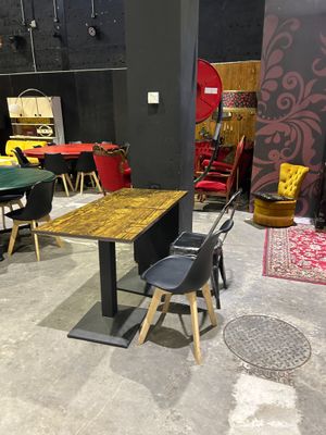 a room with a table and chairs in it
