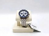 a watch that is sitting on a stand with a tag
