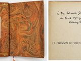 an open book with writing on it and a picture of a picture of a book with writing on it