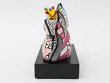 a close up of a shoe with a crown on top of it