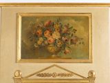 a painting of flowers in a vase on a mantle