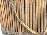 a wicker basket that has a handle on it