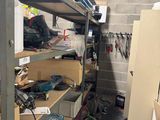 a room filled with lots of clutter and tools