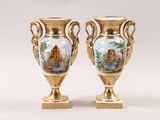 two vases that are sitting on a table