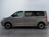 a silver van that is parked in a parking lot