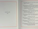 an open book with an orange border on it