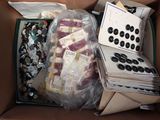 a box full of buttons and other items in it