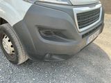 a close up of the front bumper of a van