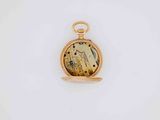 an image of a close up of a pocket watch on a white surface