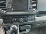the interior of a car with a steering control and dashboard controls