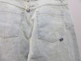 a pair of jeans that are on a white surface