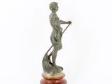 bronze statue of a man with a spear and a dog on a marble base