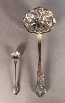two spoons and a spoon with a flower on them