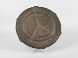 an image of a bronze plate with a woman on it