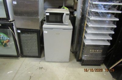 a small refrigerator and a microwave in a store