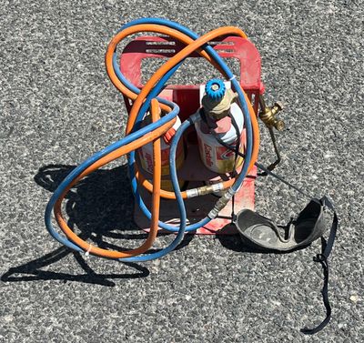 a fire hydrant and a hose on the ground