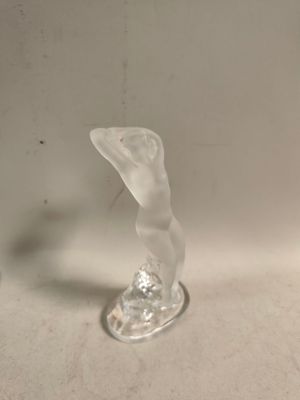 a glass vase that is sitting on a table